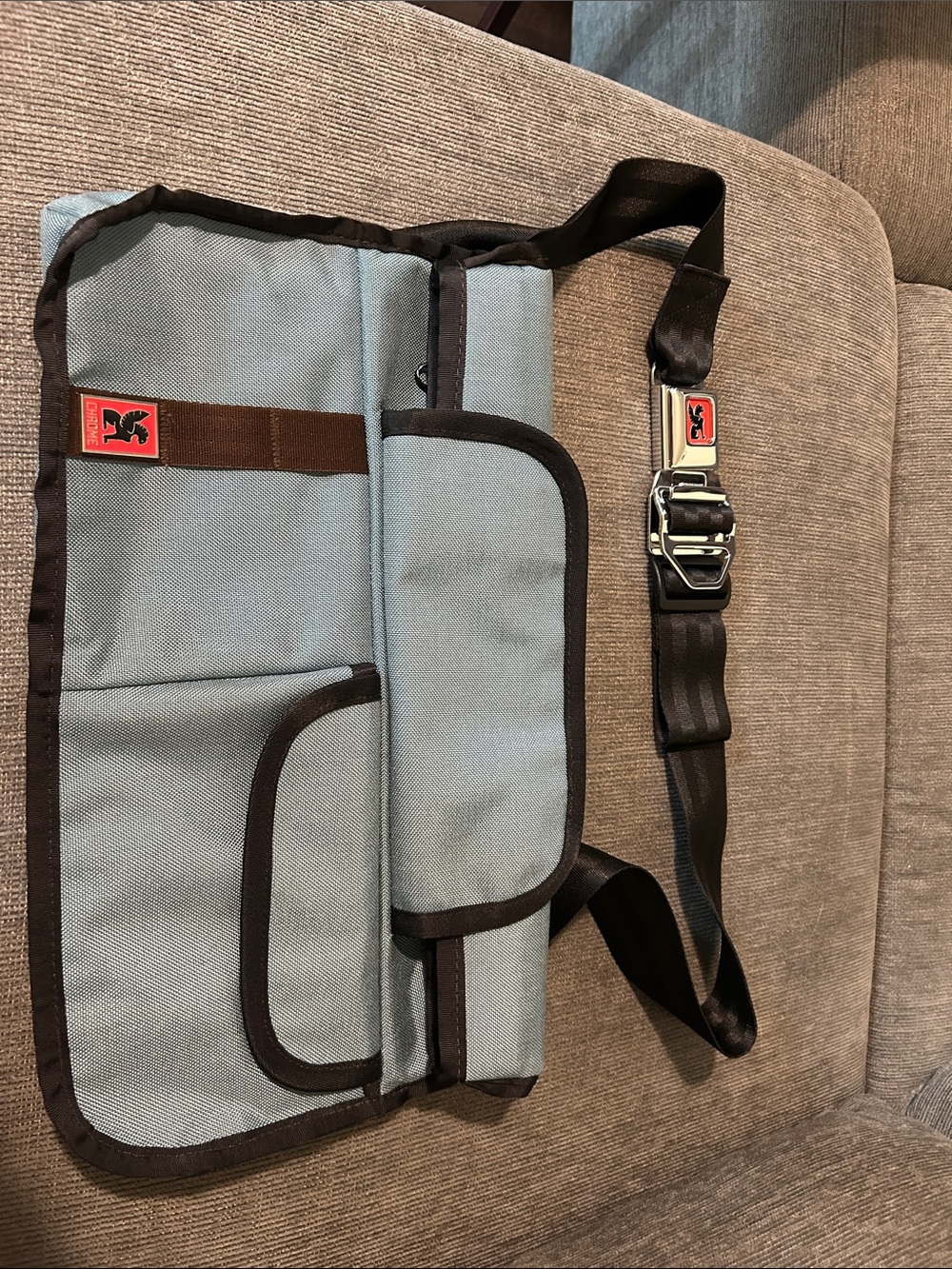 Light Blue Messenger Bag with Black Trim and Adjustable Strap